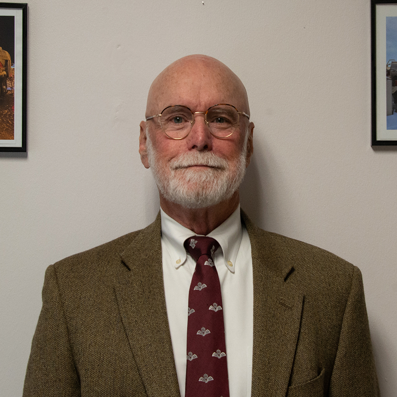 Man in suit and tie smiling